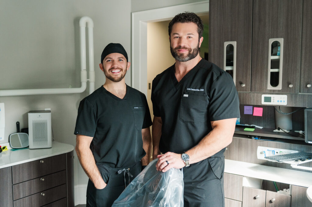 Dr. Henley and Dr. Constantine standing in a dental procedure room